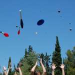 Students of the Athens College Juggling Club having the great toss up, throwing juggling props in the air at the last day of juggling class